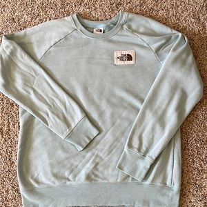 North face women’s crewneck in a light blue color. Size large.